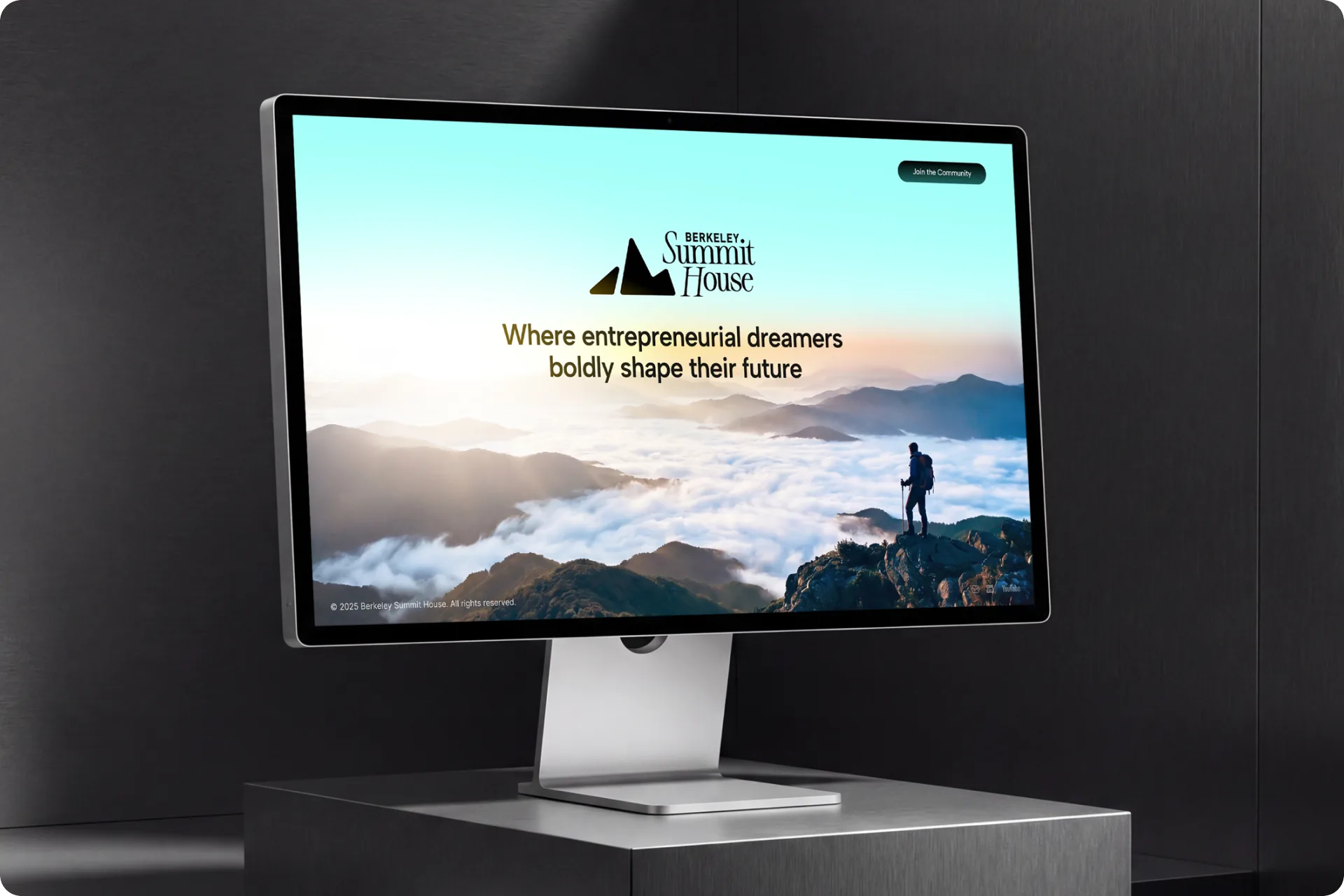 The Berkeley Summit House site on a Studio Display — a hiker above the clouds under the headline