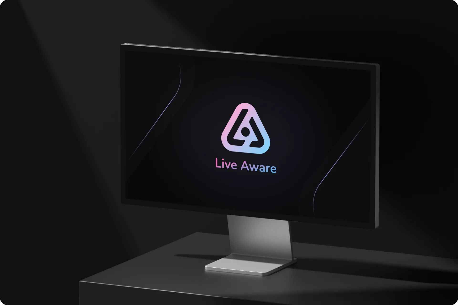 The Live Aware mark on a Studio Display in a dark room